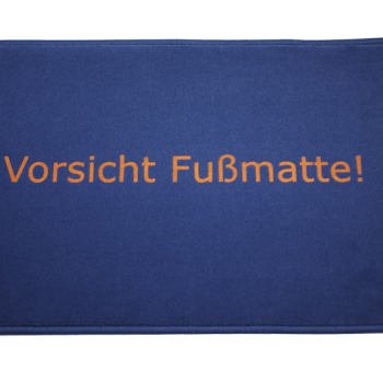 Fußmatte: Vorsicht_Fussmatte_Dreckstueckchen